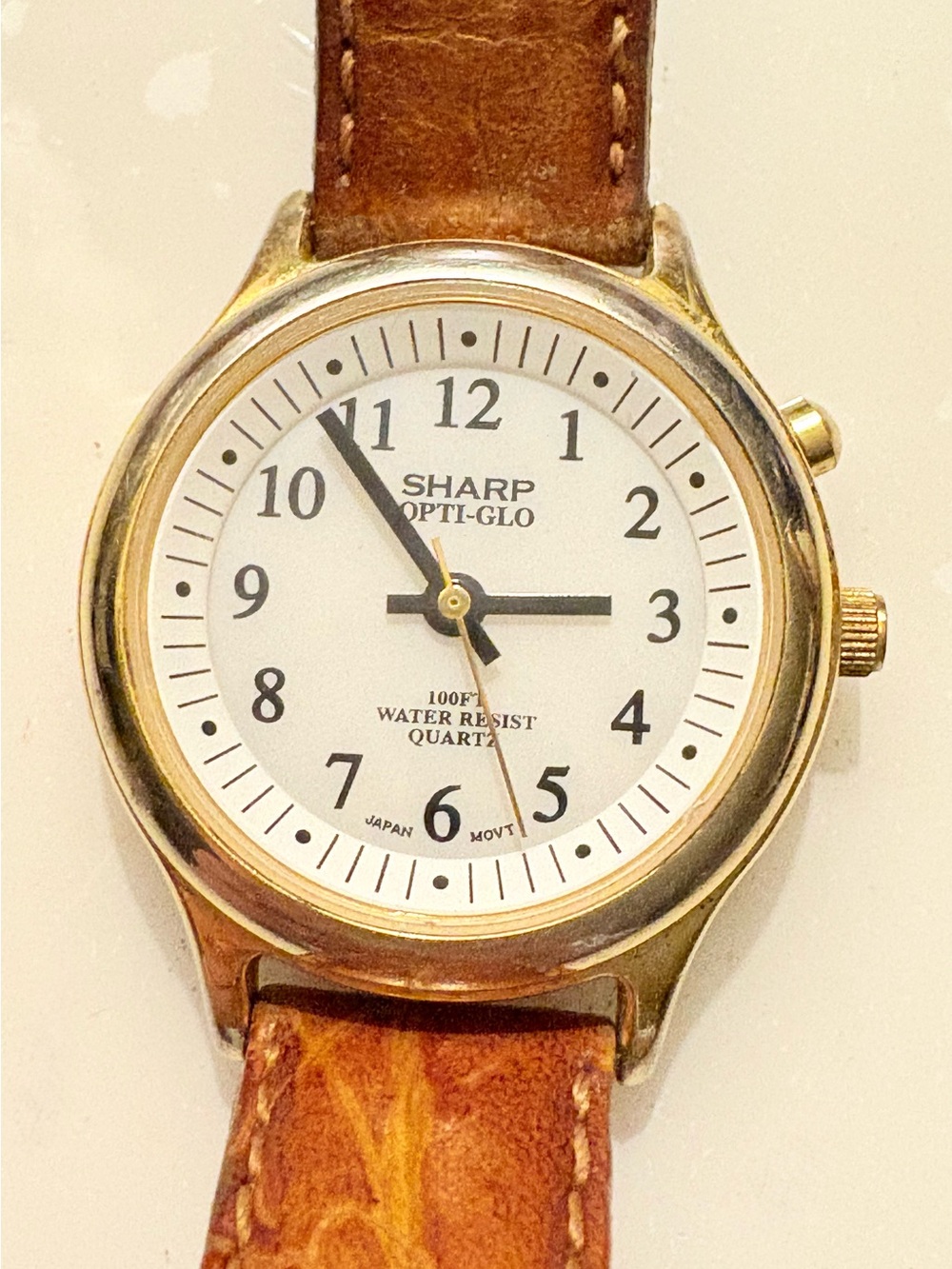 SHARP Opti-Glo Quartz 100ft
WR Gold Tone SS Brown Leather White Dial Watch